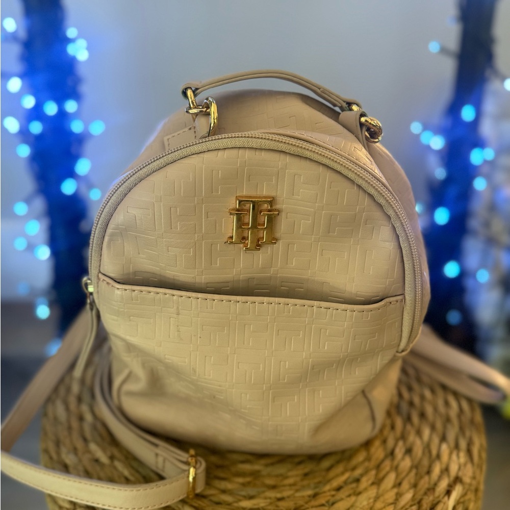 Tommy Hilfiger Small cream colored backpack.